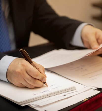 Businessman signing important contract papers. High quality photo